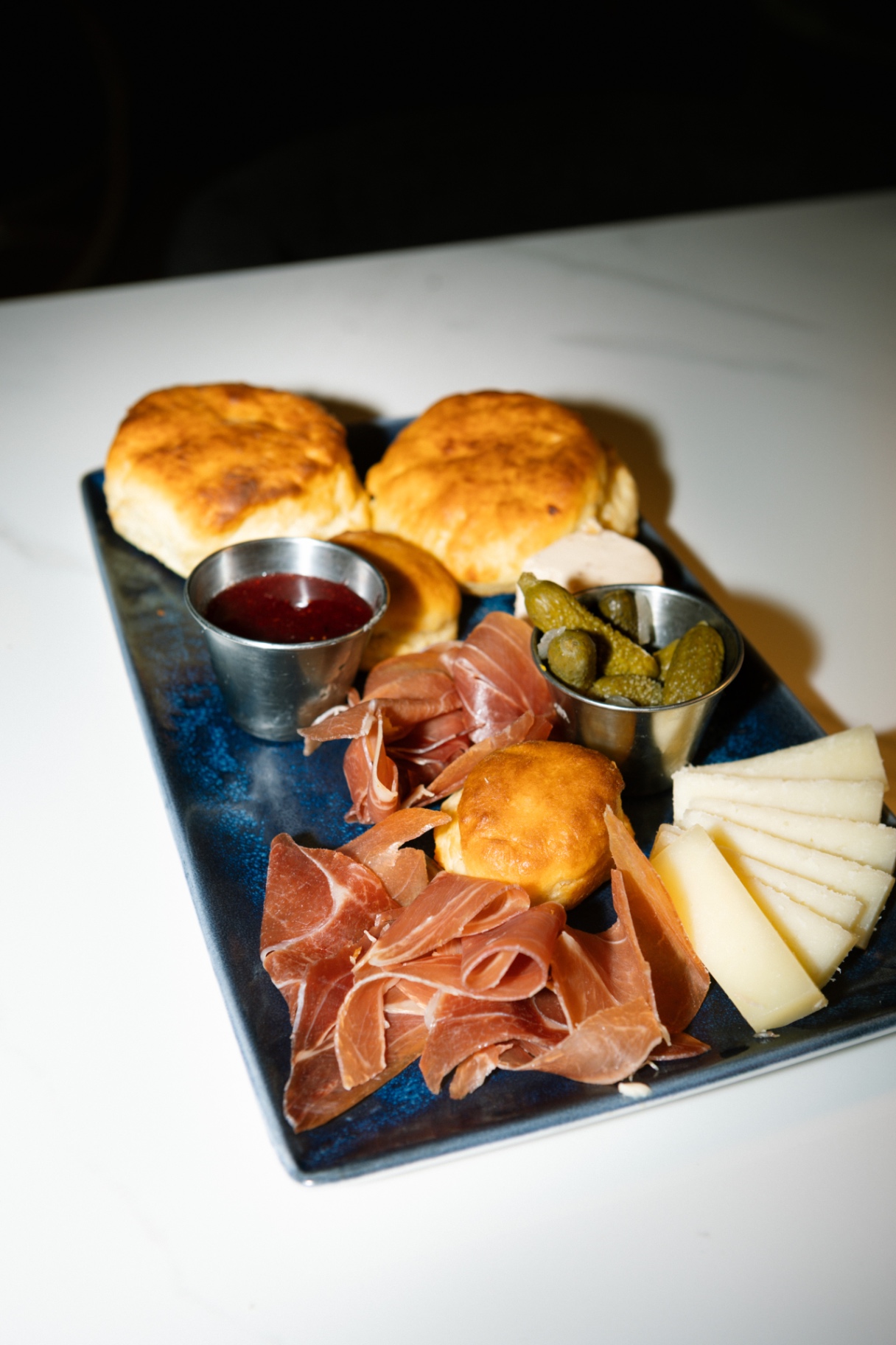 Charcuterie, biscuits, cheese, and pickles from the bit kitchen